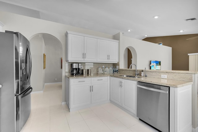 6563 Kings Creek Ter, Boynton Beach, FL 33437 - kitchen featuring refrigerator with ice dispenser, dishwasher, a sink, arched walkways, and recessed lighting