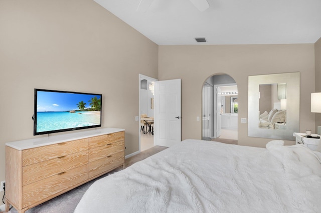 6563 Kings Creek Ter, Boynton Beach, FL 33437 - bedroom featuring vaulted ceiling, arched walkways, ensuite bathroom, carpet floors, and a ceiling fan