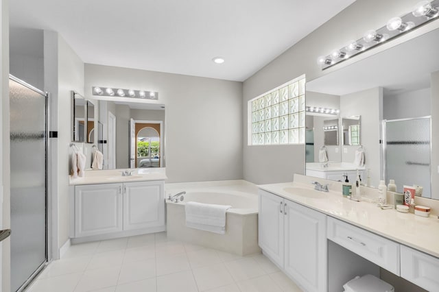 6563 Kings Creek Ter, Boynton Beach, FL 33437 - full bath with a stall shower, a bath, two vanities, and tile patterned floors