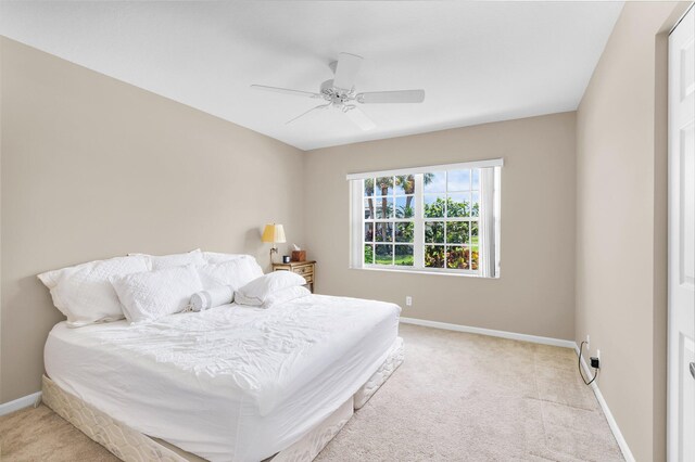 6563 Kings Creek Ter, Boynton Beach, FL 33437 - bedroom with light carpet, baseboards, and ceiling fan