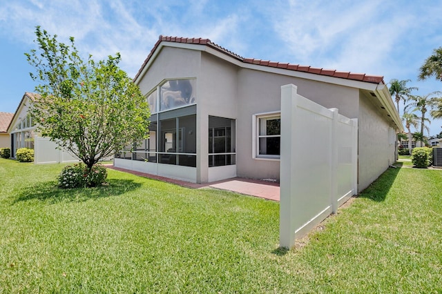6563 Kings Creek Ter, Boynton Beach, FL 33437 - rear view of property with a lawn, a tiled roof, and stucco siding