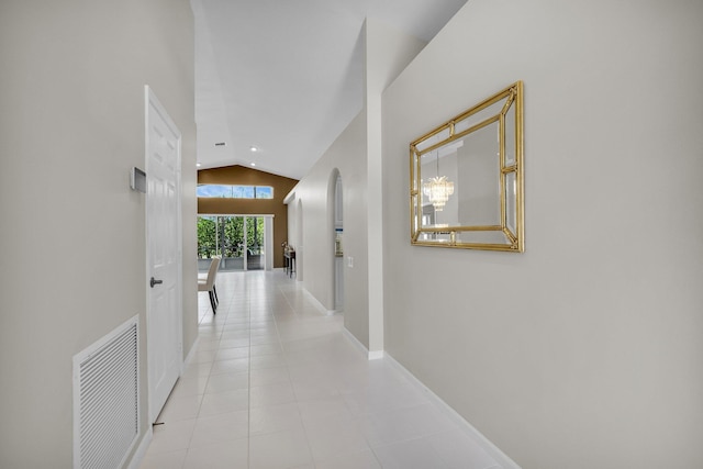 6563 Kings Creek Ter, Boynton Beach, FL 33437 - hallway featuring lofted ceiling, recessed lighting, tile patterned floors, and baseboards