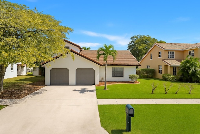 453 NE 38th St, Boca Raton, FL 33431 - mediterranean / spanish home featuring a garage, driveway, a front lawn, stucco siding, and a tiled roof