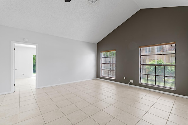 453 NE 38th St, Boca Raton, FL 33431 - unfurnished room featuring light tile patterned floors, high vaulted ceiling, baseboards, and a textured ceiling