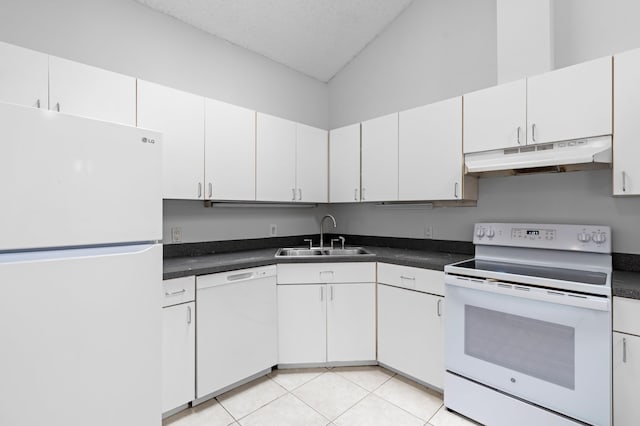 453 NE 38th St, Boca Raton, FL 33431 - kitchen with white appliances, a sink, under cabinet range hood, white cabinetry, and dark countertops