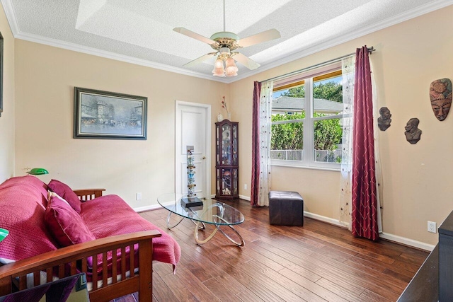 1345 SW 21st Ave, Boca Raton, FL 33486 - living room with crown molding, wood finished floors, ceiling fan, a textured ceiling, and baseboards