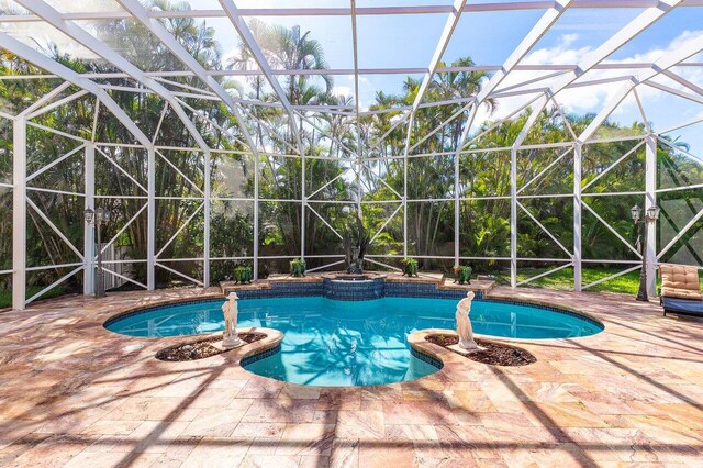 1345 SW 21st Ave, Boca Raton, FL 33486 - view of swimming pool with a patio area, a pool with connected hot tub, and glass enclosure