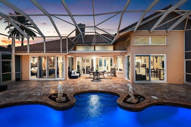 1345 SW 21st Ave, Boca Raton, FL 33486 - rear view of property with stucco siding, a patio area, an outdoor pool, and a tiled roof