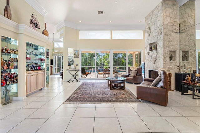 1345 SW 21st Ave, Boca Raton, FL 33486 - living area featuring crown molding, a towering ceiling, and light tile patterned floors