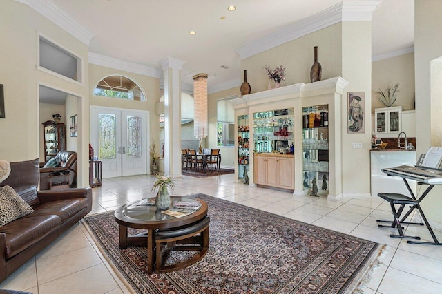1345 SW 21st Ave, Boca Raton, FL 33486 - tiled living room with ornate columns, ornamental molding, french doors, recessed lighting, and a towering ceiling