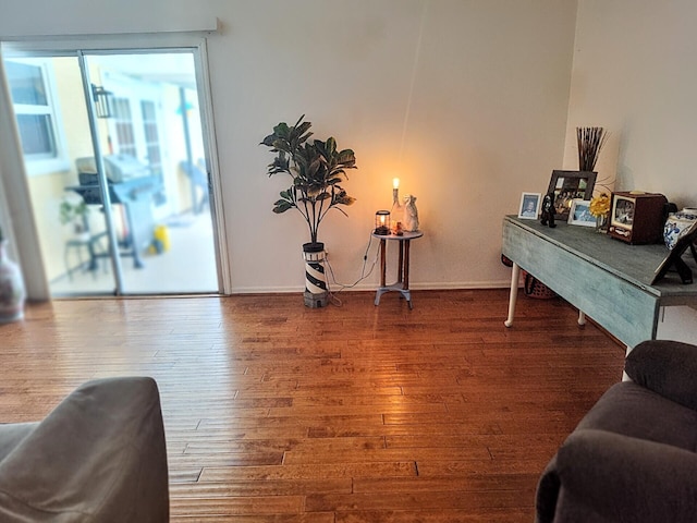 1514 SE Manth Ln, Port Saint Lucie, FL 34983 - sitting room with hardwood / wood-style floors and baseboards