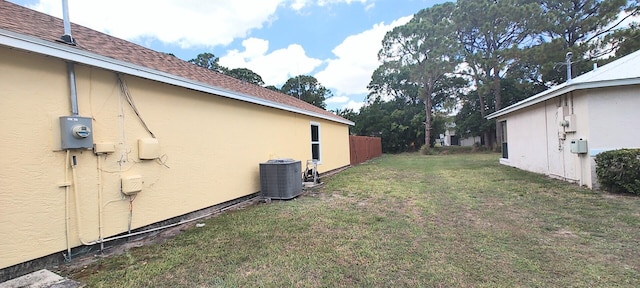 1514 SE Manth Ln, Port Saint Lucie, FL 34983 - view of green lawn featuring central air condition unit