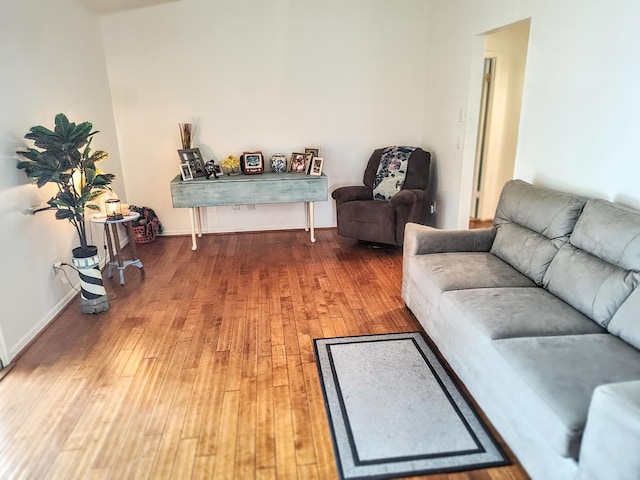 1514 SE Manth Ln, Port Saint Lucie, FL 34983 - living area featuring wood-type flooring and baseboards