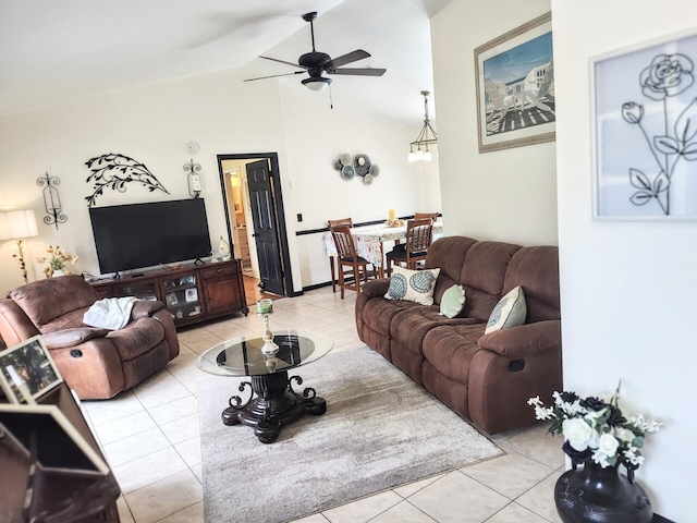 1514 SE Manth Ln, Port Saint Lucie, FL 34983 - living room featuring a ceiling fan, tile patterned floors, and vaulted ceiling