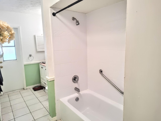 1514 SE Manth Ln, Port Saint Lucie, FL 34983 - full bathroom with bathing tub / shower combination, tile patterned flooring, vanity, and baseboards
