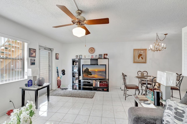 210 Chatham K, West Palm Beach, FL 33417 - living area with a chandelier, a textured ceiling, a ceiling fan, and light tile patterned floors