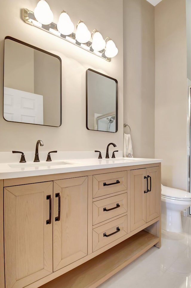 9308 Swansea Ln, West Palm Beach, FL 33411 - bathroom with double vanity and toilet
