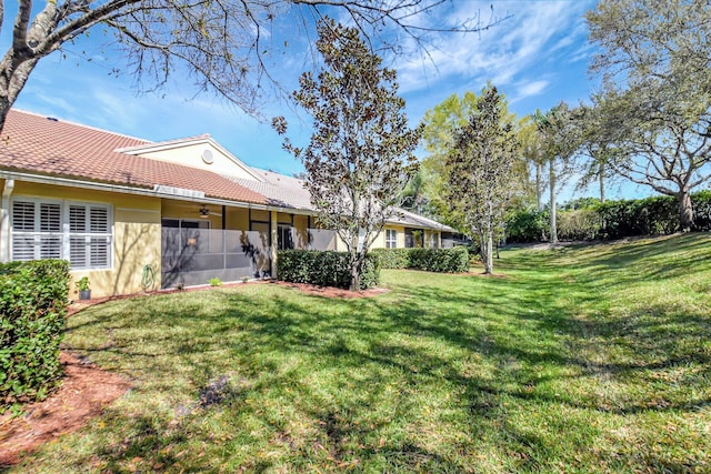 9308 Swansea Ln, West Palm Beach, FL 33411 - view of grassy yard with ceiling fan