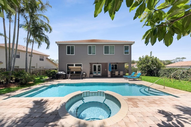 7969 Heavener Ct, Lake Worth, FL 33467 - view of pool with a pool with connected hot tub, a patio, and french doors