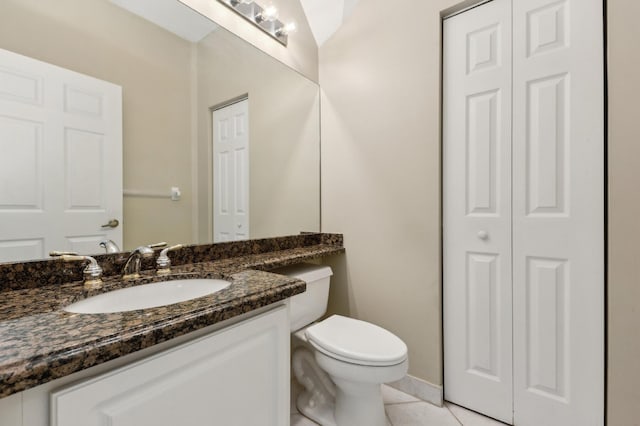 7969 Heavener Ct, Lake Worth, FL 33467 - half bathroom with a closet, vanity, toilet, and tile patterned floors
