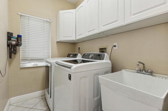 7969 Heavener Ct, Lake Worth, FL 33467 - washroom with cabinet space, separate washer and dryer, baseboards, and light tile patterned floors