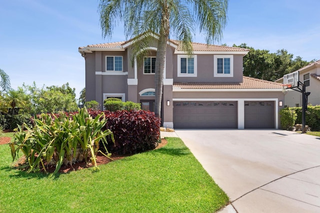 7969 Heavener Ct, Lake Worth, FL 33467 - view of front facade featuring concrete driveway, stucco siding, a tile roof, a front lawn, and an attached garage