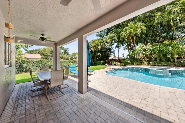 7969 Heavener Ct, Lake Worth, FL 33467 - view of swimming pool featuring ceiling fan, a patio, a pool with connected hot tub, outdoor dining space, and a fenced backyard