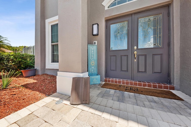 7969 Heavener Ct, Lake Worth, FL 33467 - view of exterior entry featuring stucco siding
