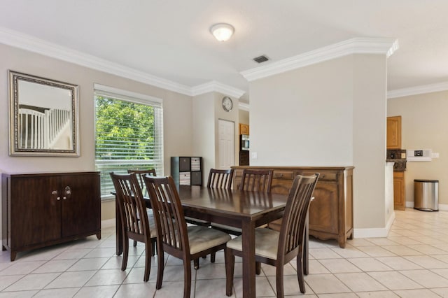 7969 Heavener Ct, Lake Worth, FL 33467 - dining area featuring ornamental molding, light tile patterned floors, and baseboards