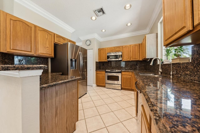 7969 Heavener Ct, Lake Worth, FL 33467 - kitchen with stainless steel appliances, a sink, light tile patterned floors, decorative backsplash, and crown molding