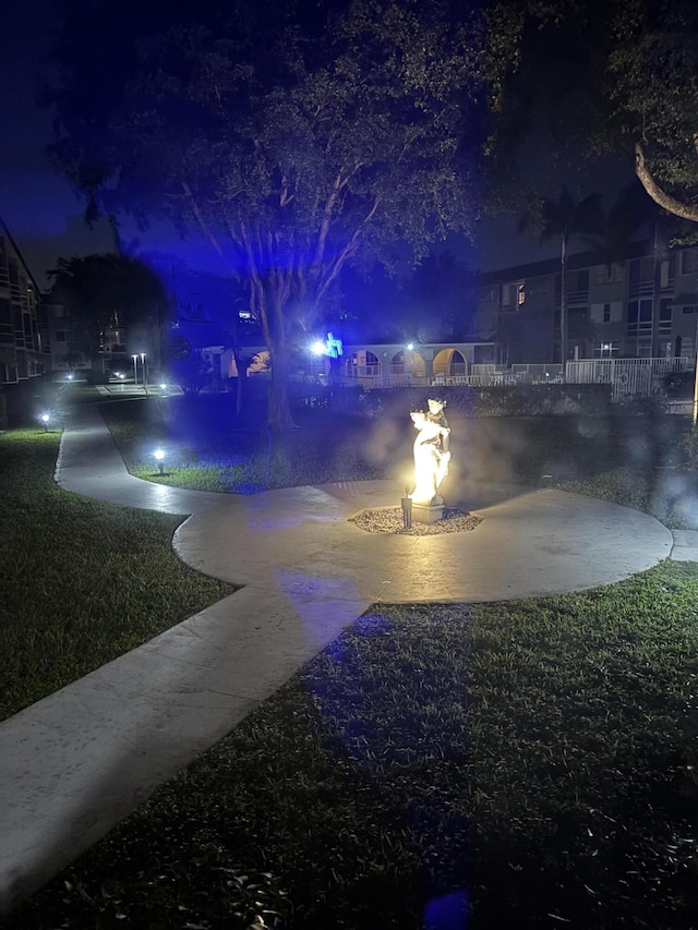 1040 SE 4th Ave Unit 129, Deerfield Beach, FL 33441 - view of yard at twilight