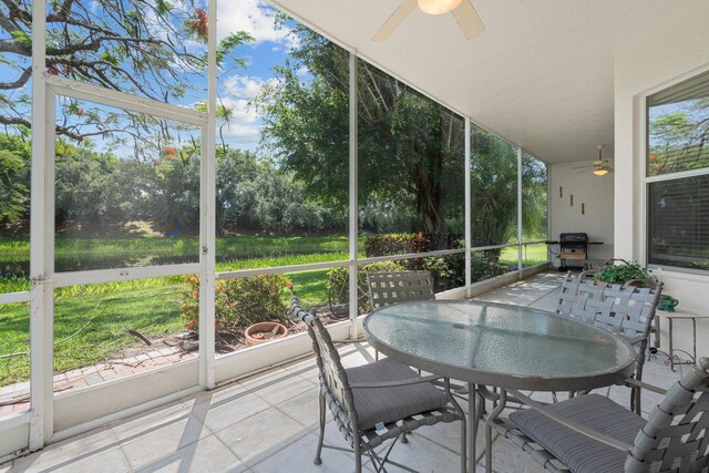 7585 Las Cruces Ct, Boynton Beach, FL 33437 - sunroom with ceiling fan and outdoor dining space