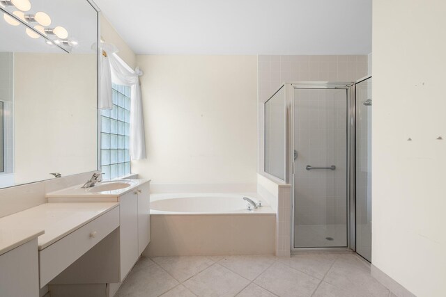 7585 Las Cruces Ct, Boynton Beach, FL 33437 - bathroom featuring vanity, a bath, a shower stall, and tile patterned flooring