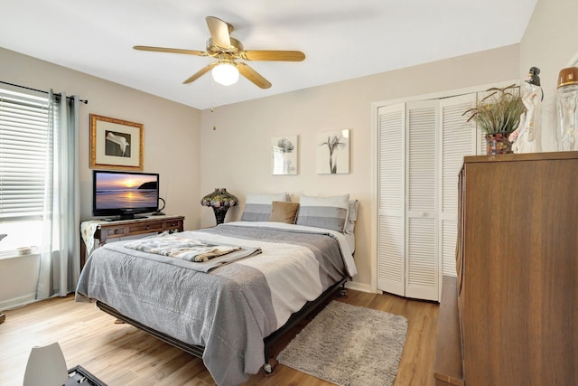 12697 Coral Breeze Dr, Wellington, FL 33414 - bedroom with multiple windows, a closet, light wood-type flooring, and ceiling fan