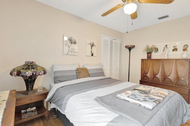 12697 Coral Breeze Dr, Wellington, FL 33414 - bedroom with wood finished floors, a closet, and a ceiling fan