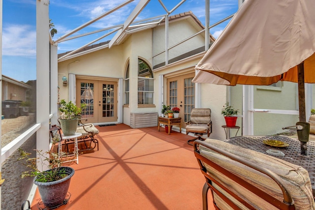 12697 Coral Breeze Dr, Wellington, FL 33414 - sunroom / solarium featuring french doors