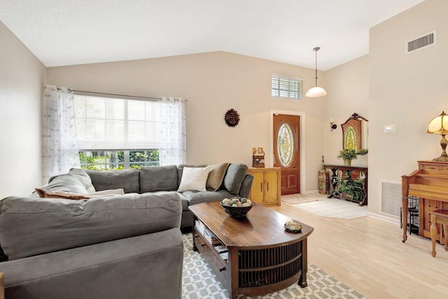 12697 Coral Breeze Dr, Wellington, FL 33414 - living area featuring lofted ceiling, light wood-type flooring, and baseboards