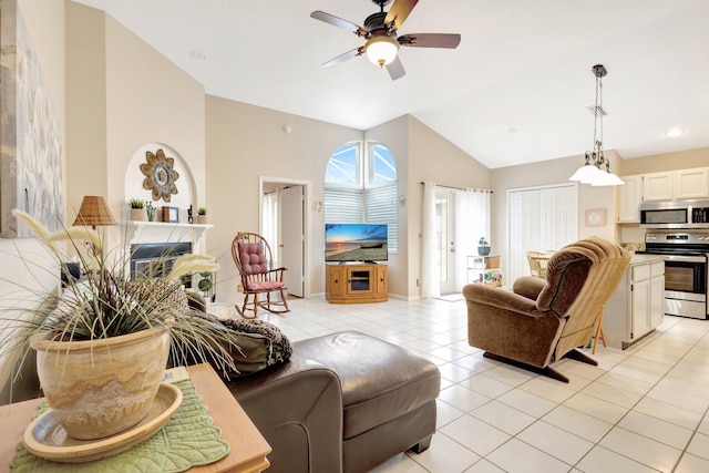 12697 Coral Breeze Dr, Wellington, FL 33414 - living area with a ceiling fan, light tile patterned flooring, and high vaulted ceiling
