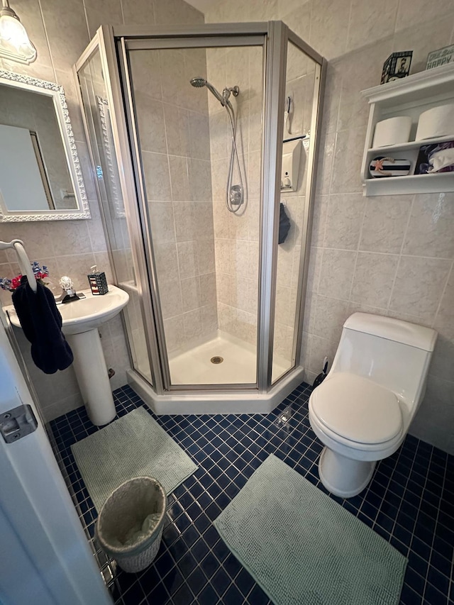 1120 Mahogany Way Unit 204, Delray Beach, FL 33445 - full bathroom with tile walls, toilet, a shower stall, and tile patterned flooring