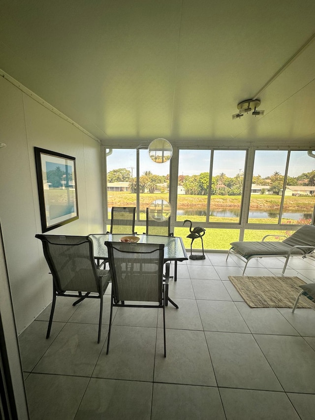1120 Mahogany Way Unit 204, Delray Beach, FL 33445 - sunroom / solarium with a water view, healthy amount of natural light, tile patterned floors, and outdoor dining area