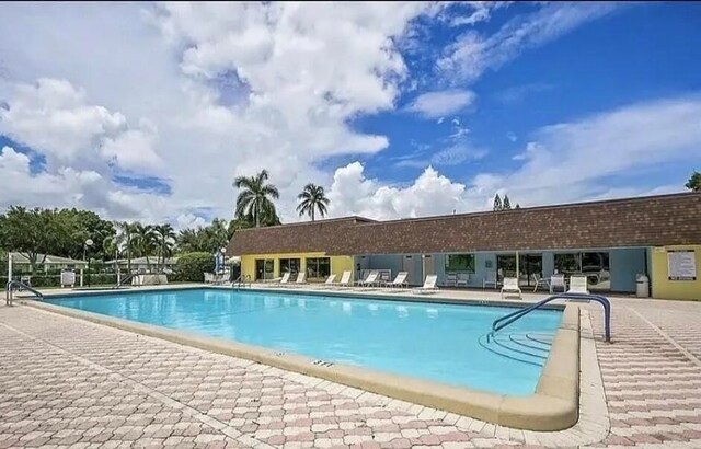 1120 Mahogany Way Unit 204, Delray Beach, FL 33445 - community pool with a patio area