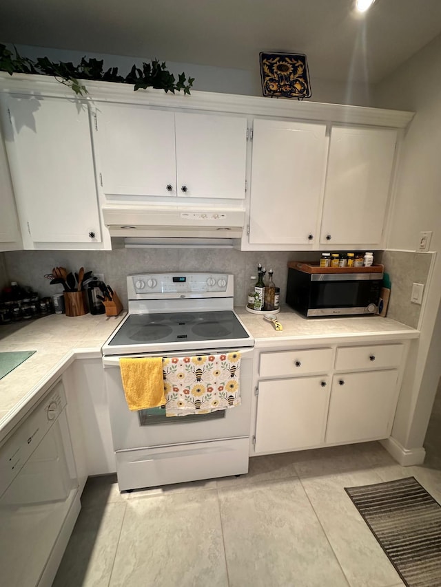 1120 Mahogany Way Unit 204, Delray Beach, FL 33445 - kitchen with electric range, stainless steel microwave, range hood, and white cabinets