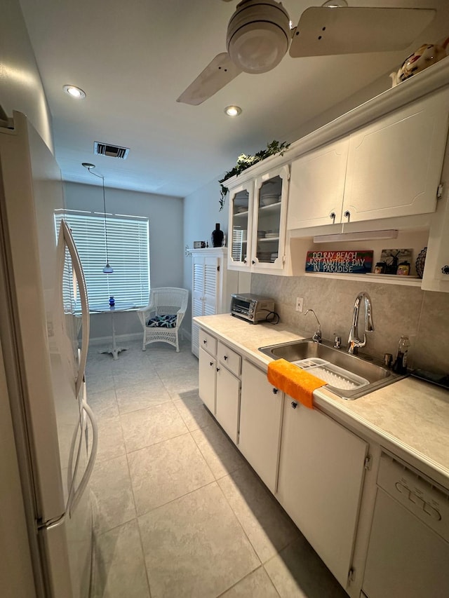 1120 Mahogany Way Unit 204, Delray Beach, FL 33445 - kitchen with freestanding refrigerator, a sink, light countertops, decorative backsplash, and recessed lighting