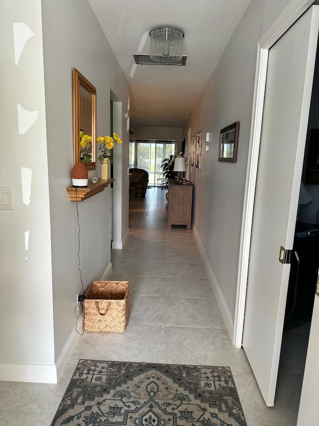 1120 Mahogany Way Unit 204, Delray Beach, FL 33445 - corridor featuring light tile patterned floors and baseboards