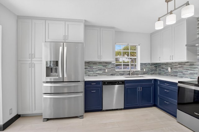 9329 Boca Gardens Cir S Unit D, Boca Raton, FL 33496 - kitchen featuring appliances with stainless steel finishes, blue cabinetry, and light countertops