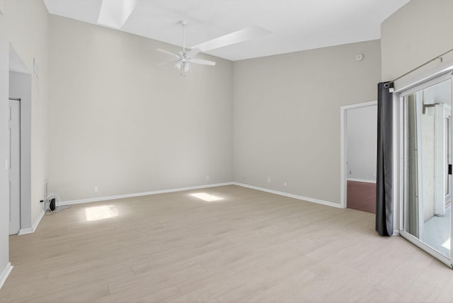 9329 Boca Gardens Cir S Unit D, Boca Raton, FL 33496 - unfurnished room with ceiling fan, light wood-style floors, and a skylight