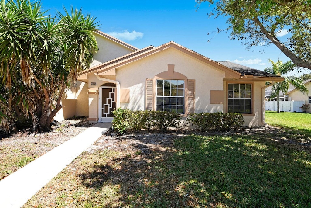 9329 Boca Gardens Cir S Unit D, Boca Raton, FL 33496 - mediterranean / spanish home featuring stucco siding