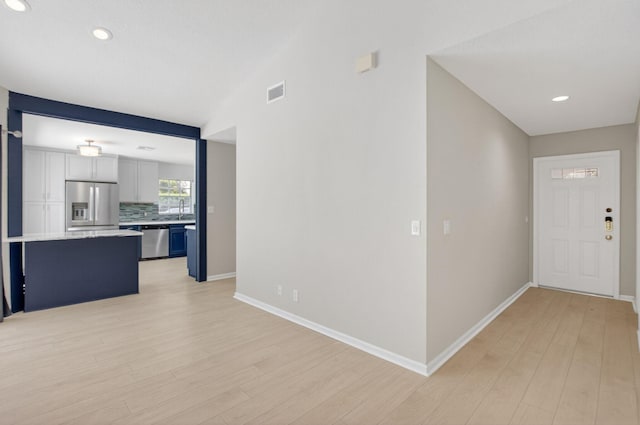 9329 Boca Gardens Cir S Unit D, Boca Raton, FL 33496 - unfurnished living room featuring light wood finished floors and recessed lighting