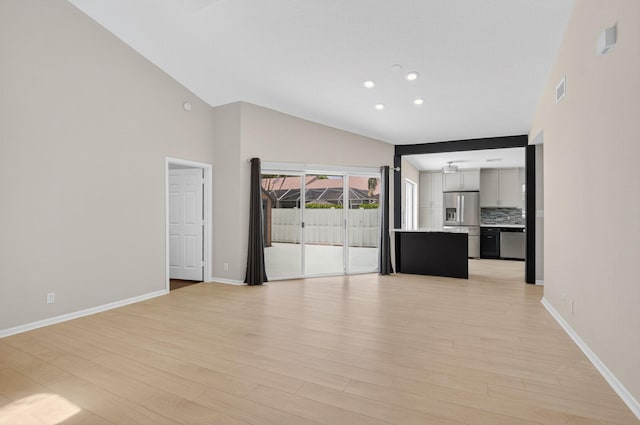 9329 Boca Gardens Cir S Unit D, Boca Raton, FL 33496 - unfurnished living room featuring light wood-type flooring, recessed lighting, and a high ceiling