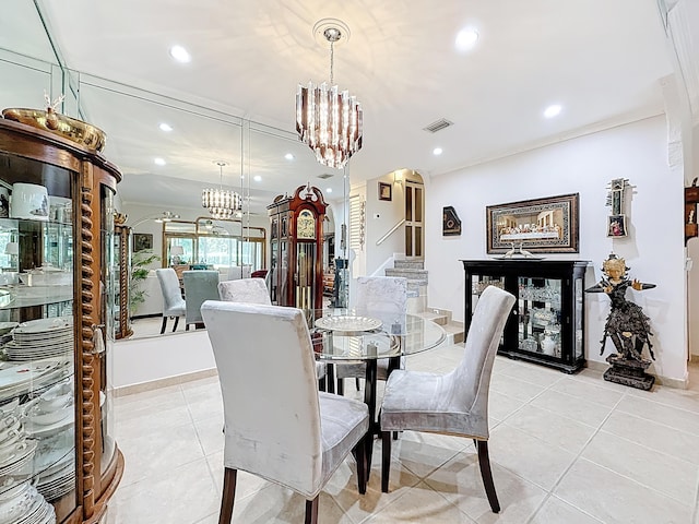 3622 Citrus Trce Unit 2, Davie, FL 33328 - dining area featuring a chandelier, recessed lighting, stairs, light tile patterned floors, and arched walkways